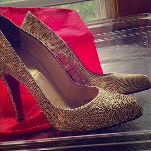 A pair of red bottom Christian Louboutin